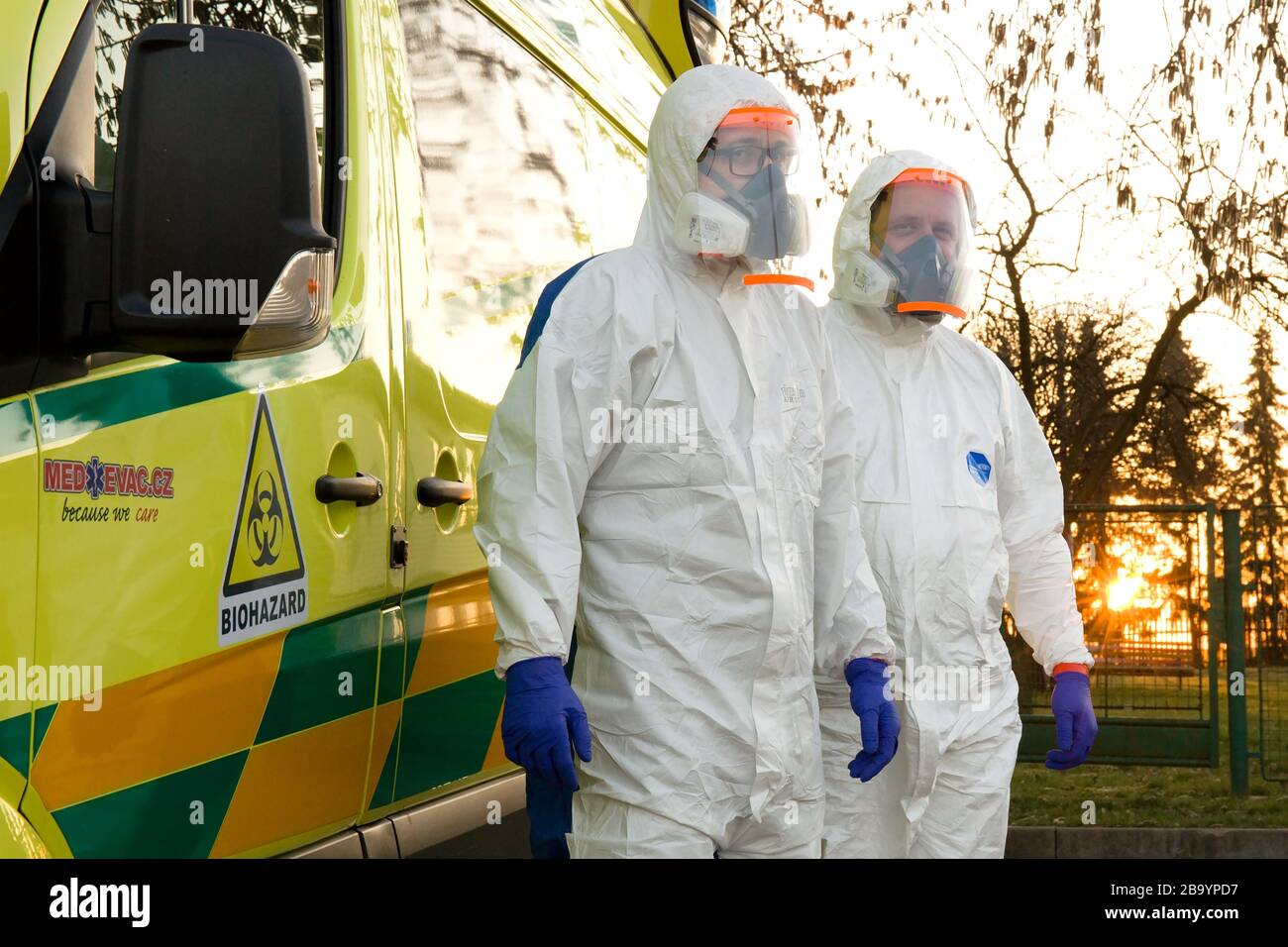 Mutejovice, Czech Republic. 24th Mar, 2020. Paramedics in a protective suits and special infectious ambulance for the collection of biological samples of patients suspected of being coronavirus infected are seen on March 24, 2020, at the base in Mutejovice, Rakovnik, Czech Republic. Credit: Jaroslav Benes/CTK Photo/Alamy Live News Stock Photo