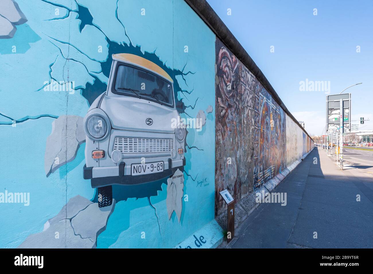 The East Side Gallery, an intact stretch of the Berlin Wall that is usually bustling with tourists, is deserted due the corona virus lockdown Stock Photo