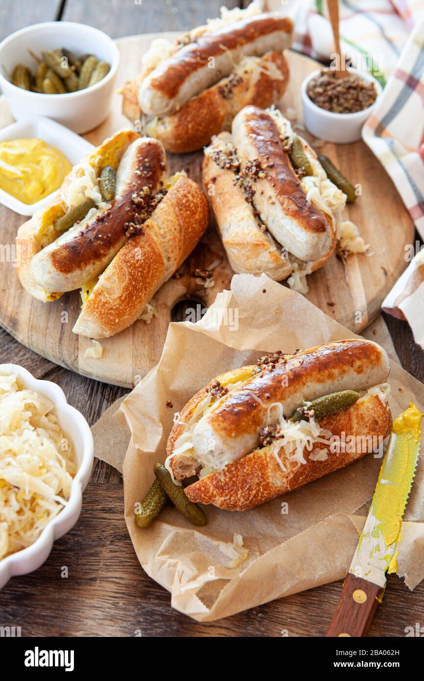 Delicious pork sausage hot dogs with sauerkraut and mustard Stock Photo