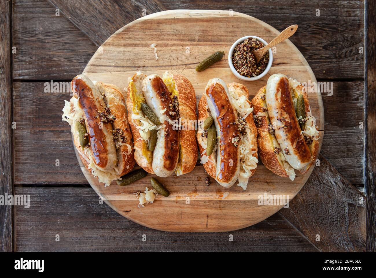 Delicious pork sausage hot dogs with sauerkraut and mustard Stock Photo