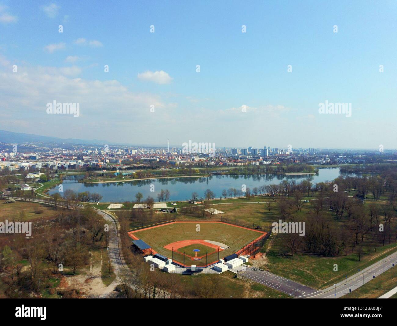 Drone flying over Sava river and Jarun lake in Zagreb with baseball