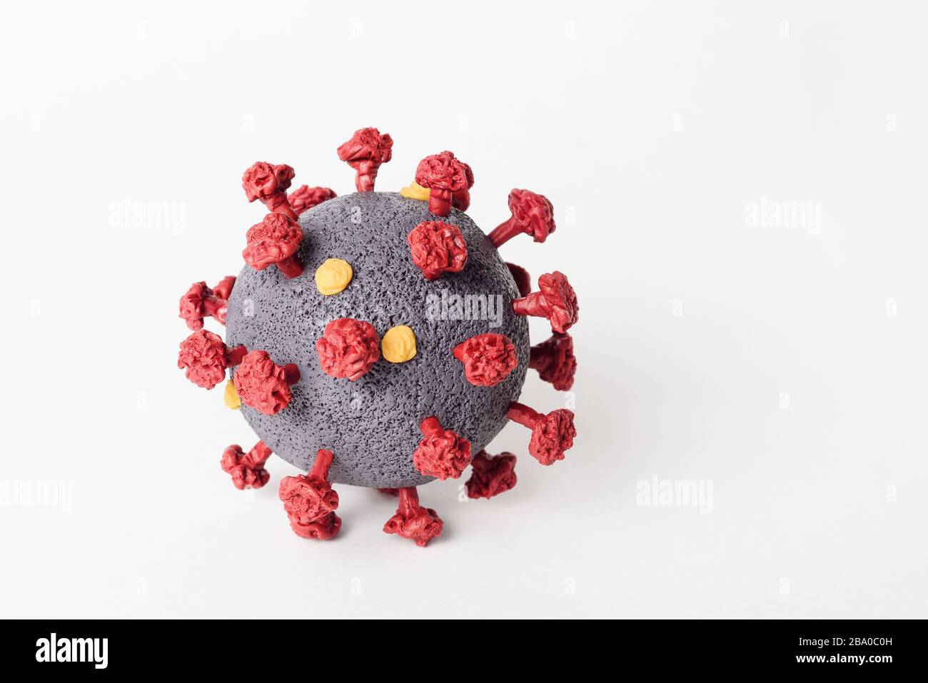 Coronavirus SARS-CoV-2 model close-up on a white background. Dangerous Infectious Disease Virus - COVID-19 Stock Photo