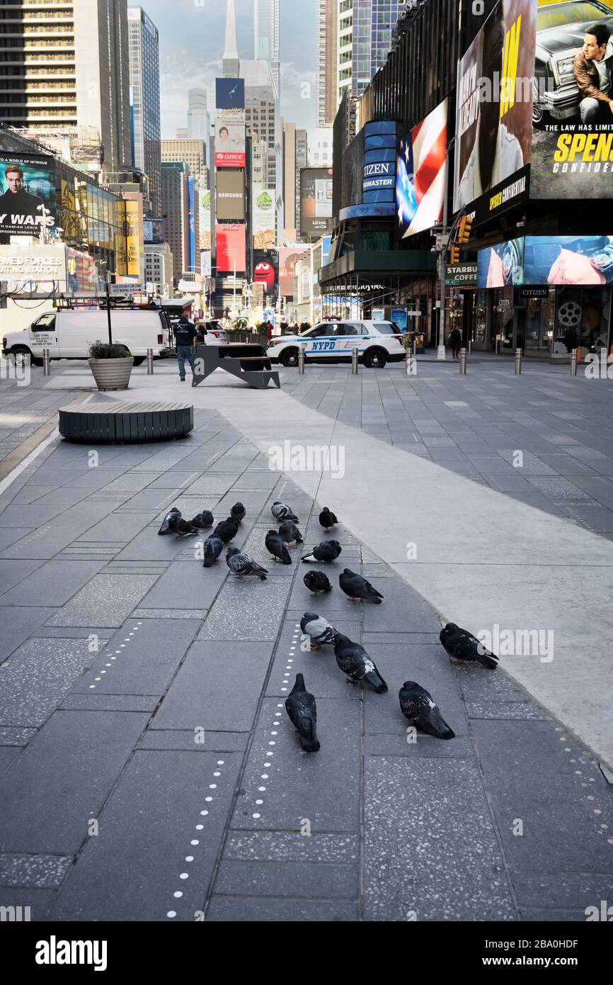 New York Times Square during Corona Virus outbreak quarantine mostly empty Stock Photo