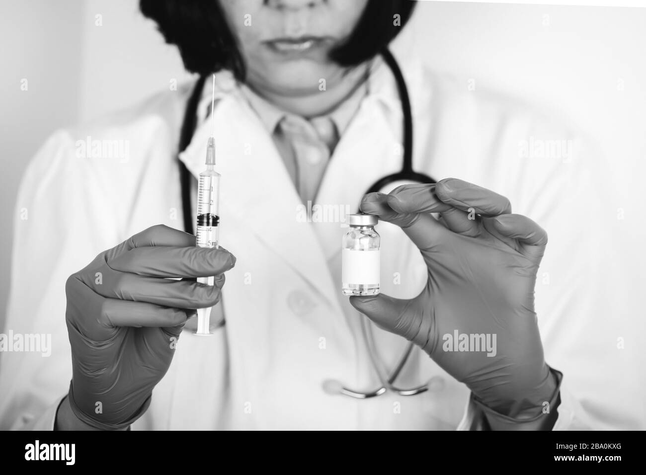 Nurse injecting dose vaccine Black and White Stock Photos & Images - Alamy