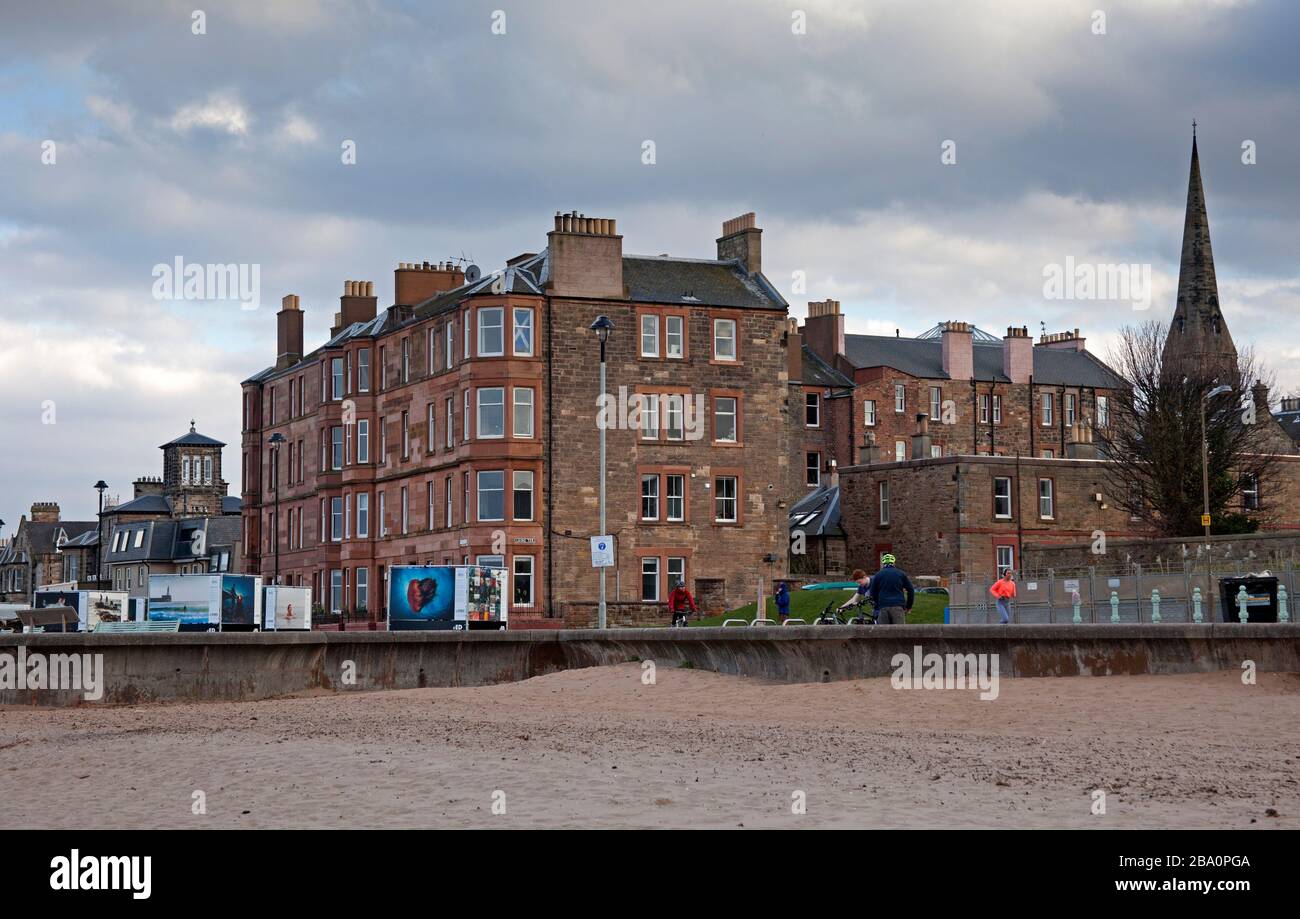 Portobello, Edinburgh, Scotland, UK. 25th March 2020. Extremely quiet afternoon on Portobello Beach promenade. Few people will be viewing the Out of The Blue Science Festival Photo Display. Stock Photo