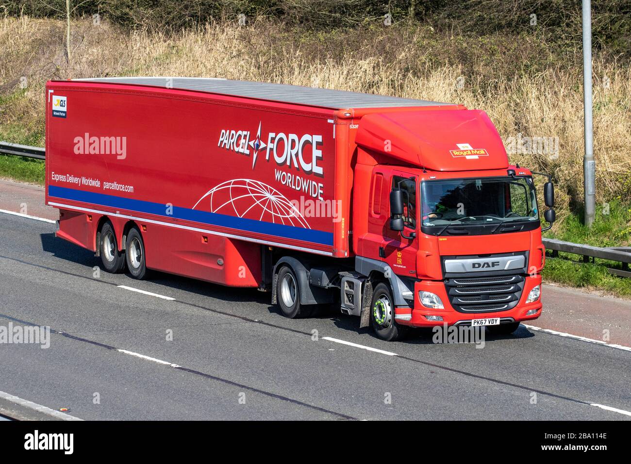 Parcel Force Worldwide Haulage delivery trucks, Post Office lorry, transportation, truck, cargo carrier, DAF HGV vehicle, European commercial transport industry, M6 at Manchester, UK Stock Photo