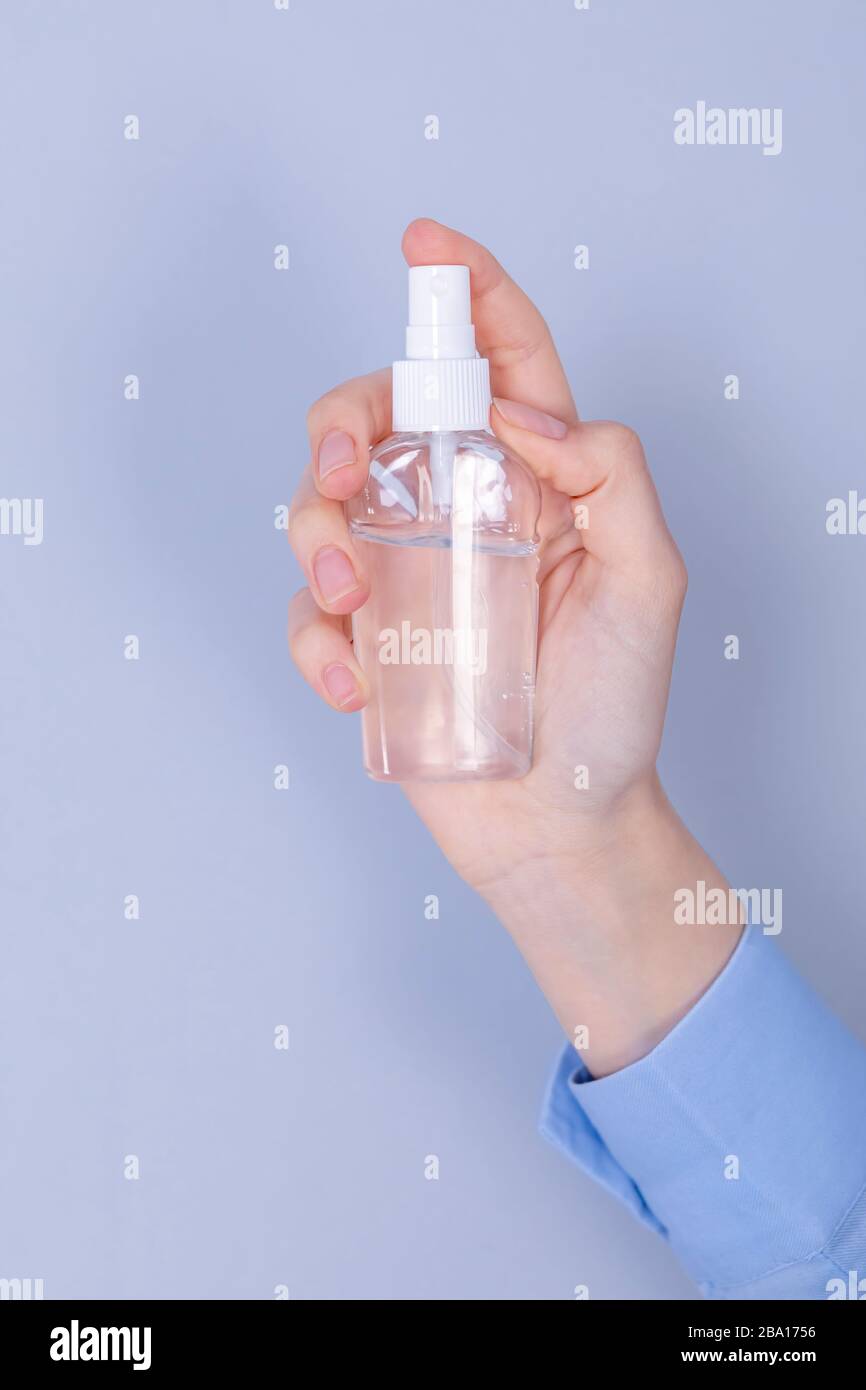 COVID-19 Pandemic Coronavirus Close up woman hands using hands sanitizer alcohol gel dispenser, against 2019-nCoV. Antiseptic, Hygiene and Healthcare Stock Photo