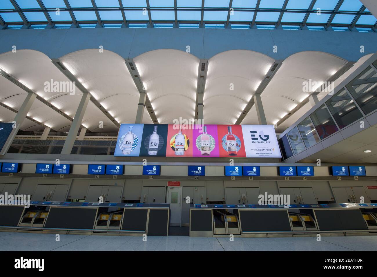Glasgow, UK. 25th Mar, 2020. Pictured: Views the interior of Glasgow Airport passenger terminal showing the place deserted due to airlines suspending and cancelling flights due to the coronavirus pandemic. Credit: Colin Fisher/Alamy Live News Stock Photo