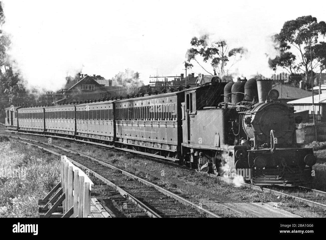 'A DS class (an ex NZR Wf class) on the down Cadbury's workers train made up of 60ft BBA class suburban carriages approaching Moonah station, 20th Oct 1947. TGR photo 4T15. Ted Lidster Collection; 20 October 1947; EL048 015; Trainiac from Australia; ' Stock Photo
