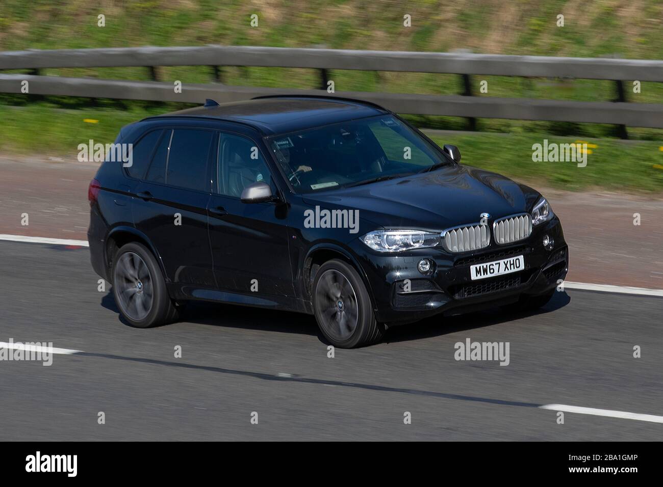 2017 black BMW X5 M50D Auto; moving vehicles, vehicle driving, roads, motors, motoring  on the M6 motorway highway Stock Photo