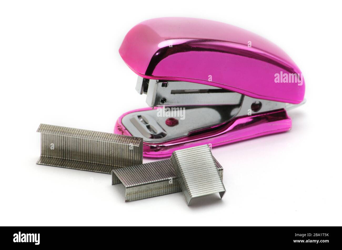 Pink office stapler on an isolated white background Stock Photo - Alamy