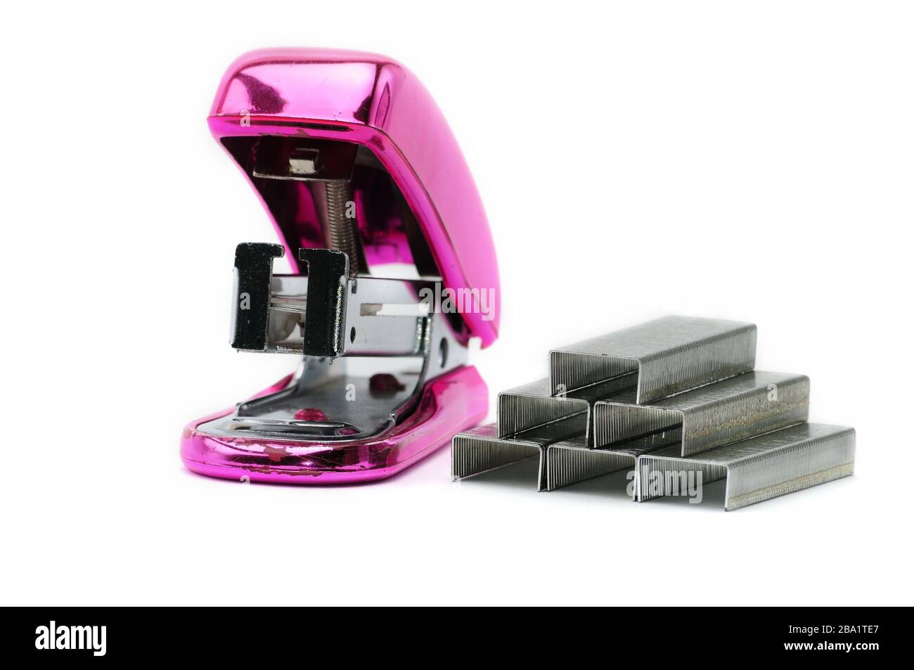 Pink office stapler on an isolated white background Stock Photo - Alamy