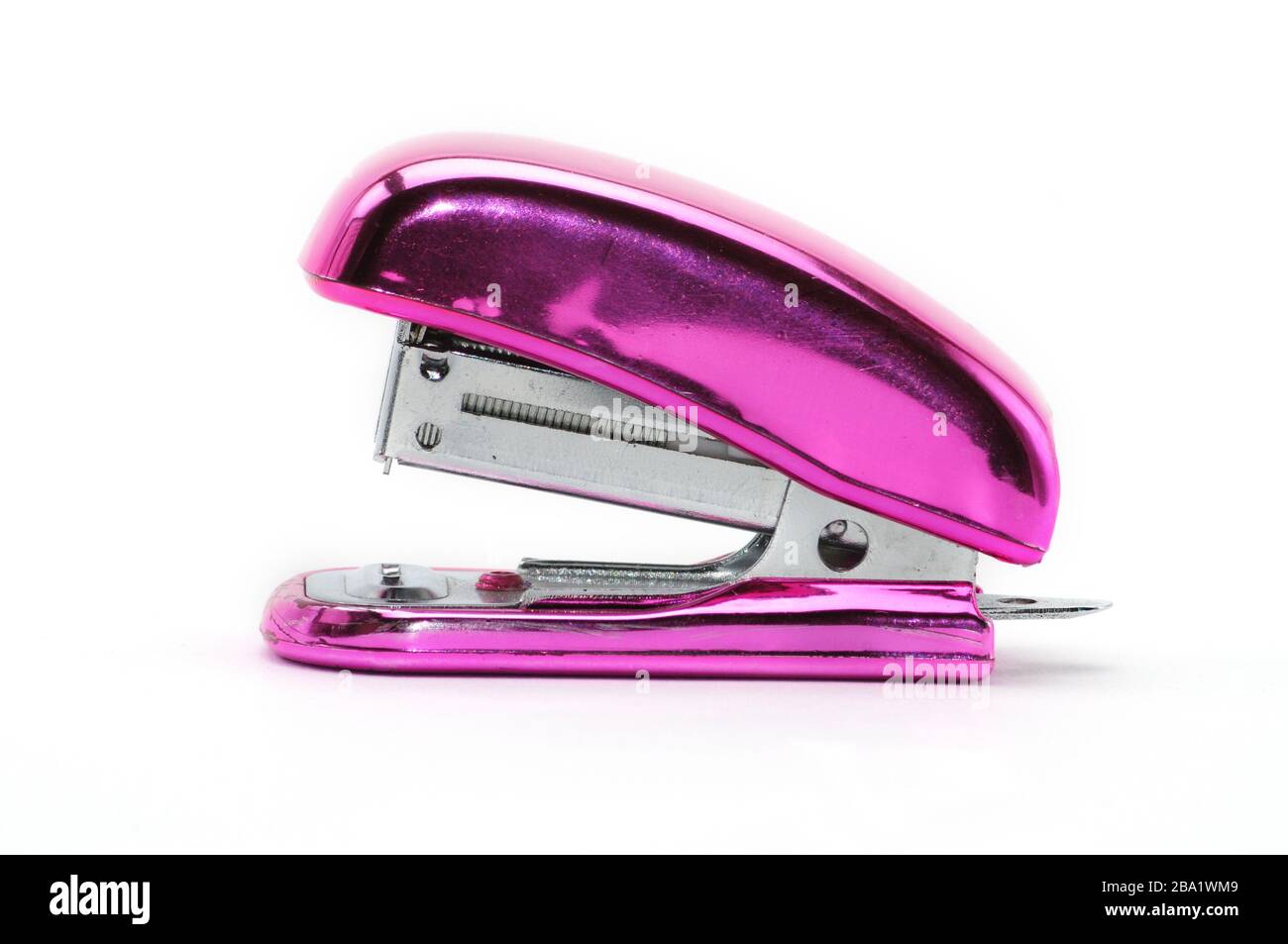 Pink office stapler on an isolated white background Stock Photo - Alamy