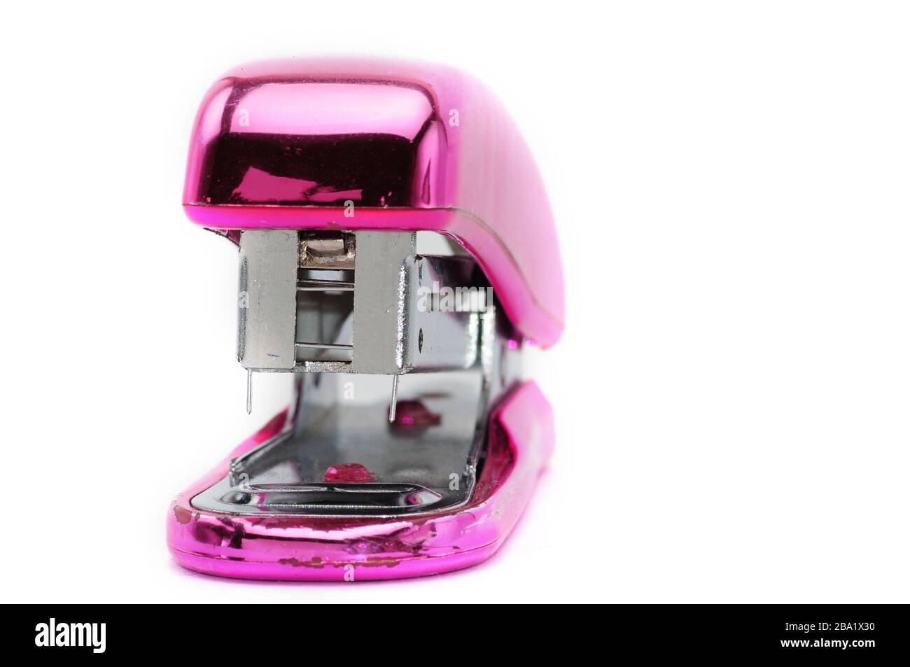 Pink office stapler on an isolated white background Stock Photo - Alamy