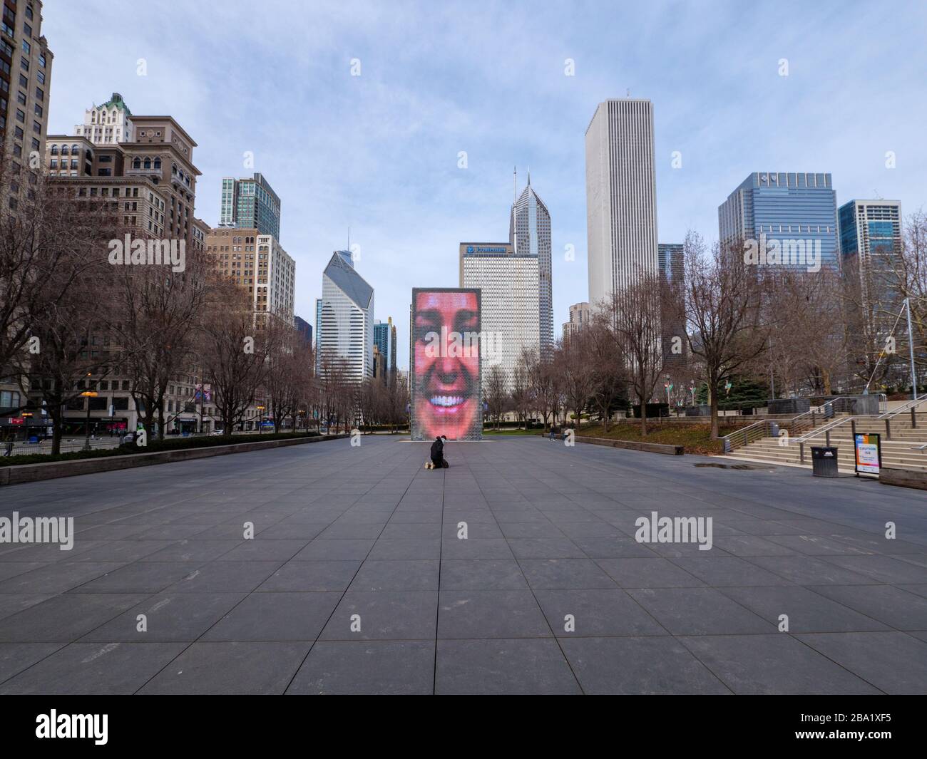 Chicago, Illinois, USA. 24th March 2020. Crown Fountain in Millennium Park, which usually attracts many people is mostly empty today do to the stay at home order in effect. Stock Photo