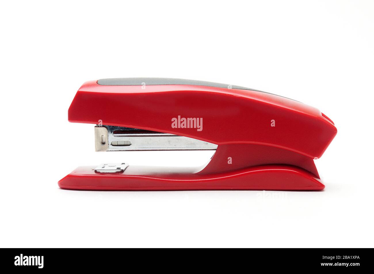 Red office stapler on an isolated white background Stock Photo - Alamy