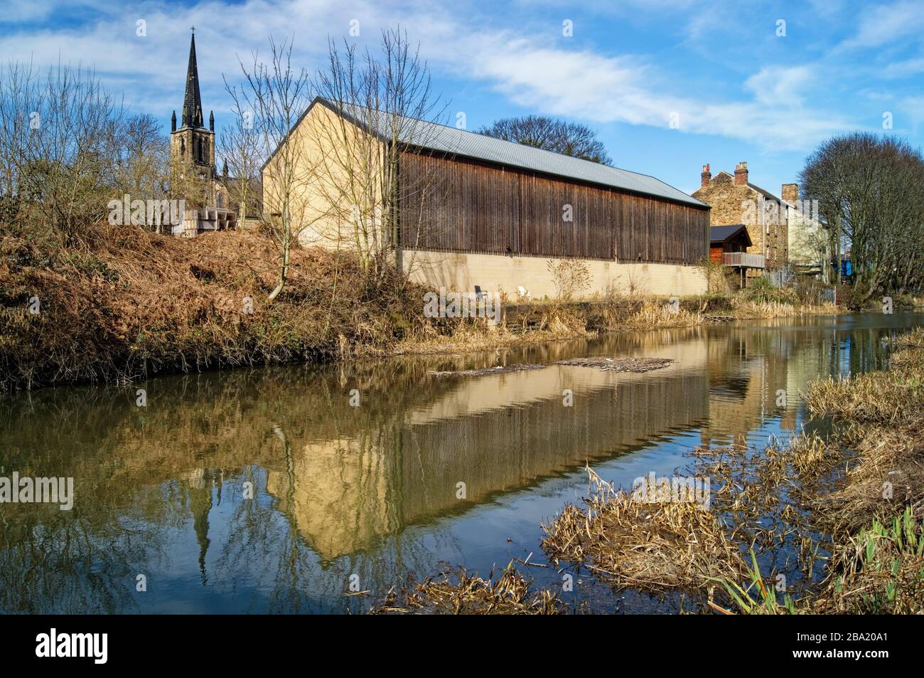UK,South Yorkshire,Elsecar,Holy Trinity Parish Church and buildings next to Elsecar Canal Stock Photo