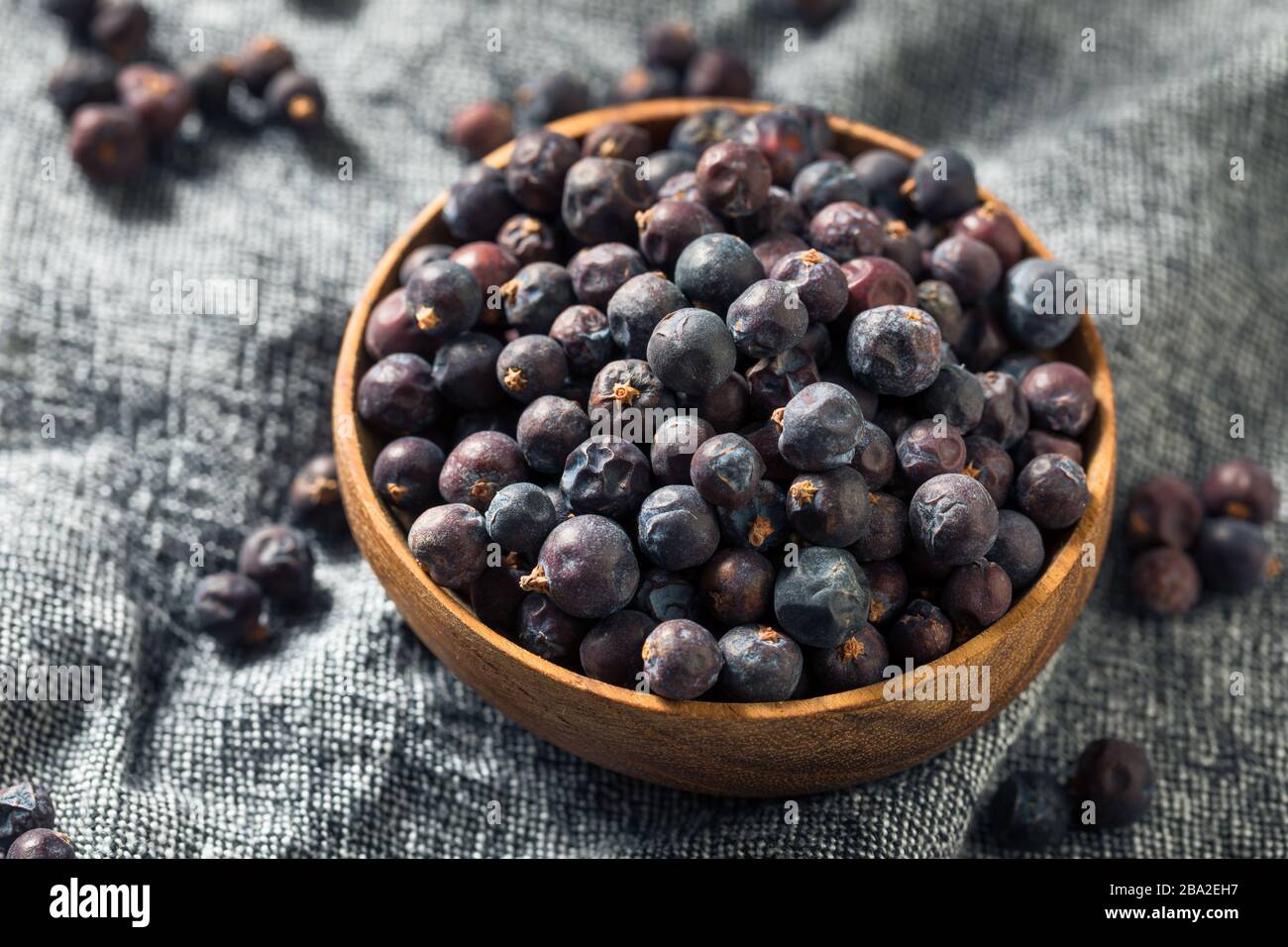 Raw Purple Organic Juniper Berries in a Bowl Stock Photo