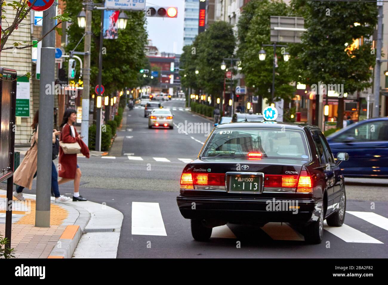 Taxi on the street in Tokyo Stock Photo