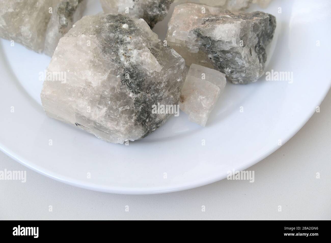 on a white background mineral source rock salt components Stock Photo