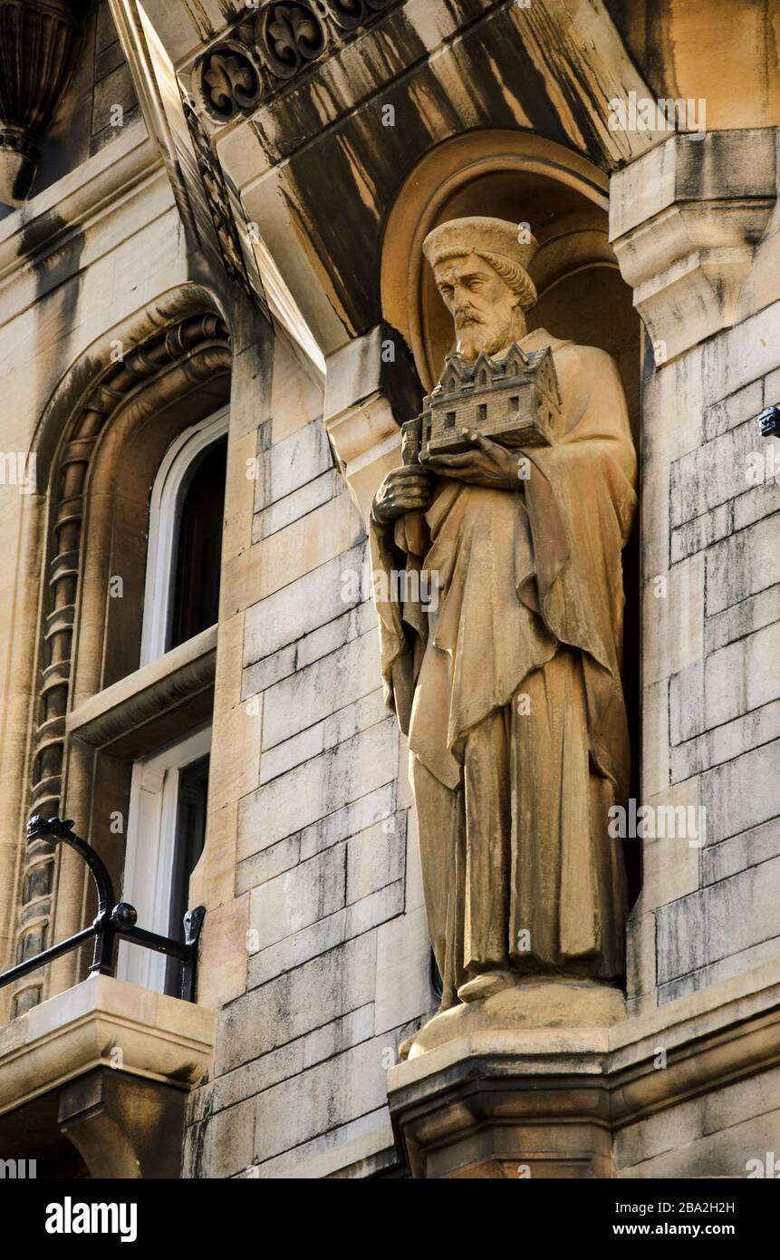 Historical statue holding a house in Cambridge Stock Photo Alamy