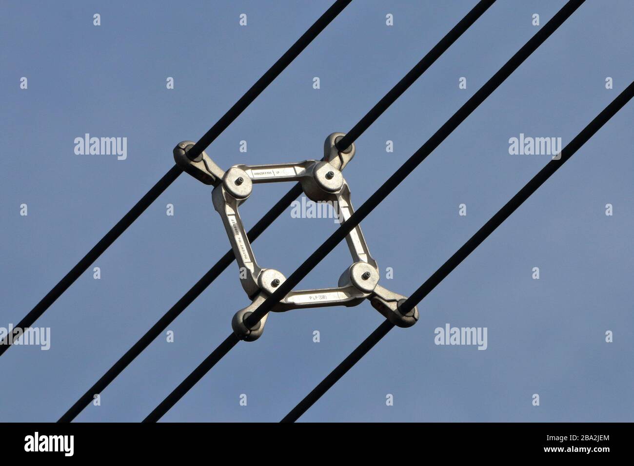 over head power line spacer damper for a four bundled conductors Stock