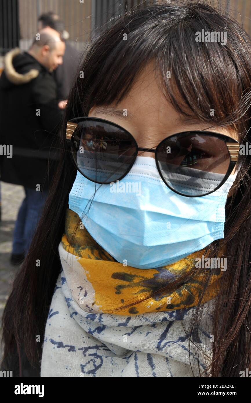 Asian Woman protected with face mask Stock Photo