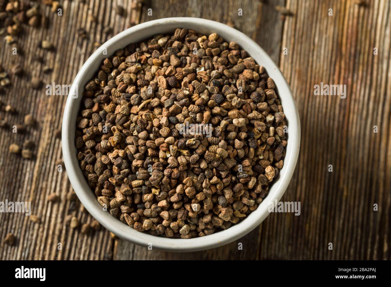 Raw Organic Brown Cardamom Seeds in a Bowl Stock Photo