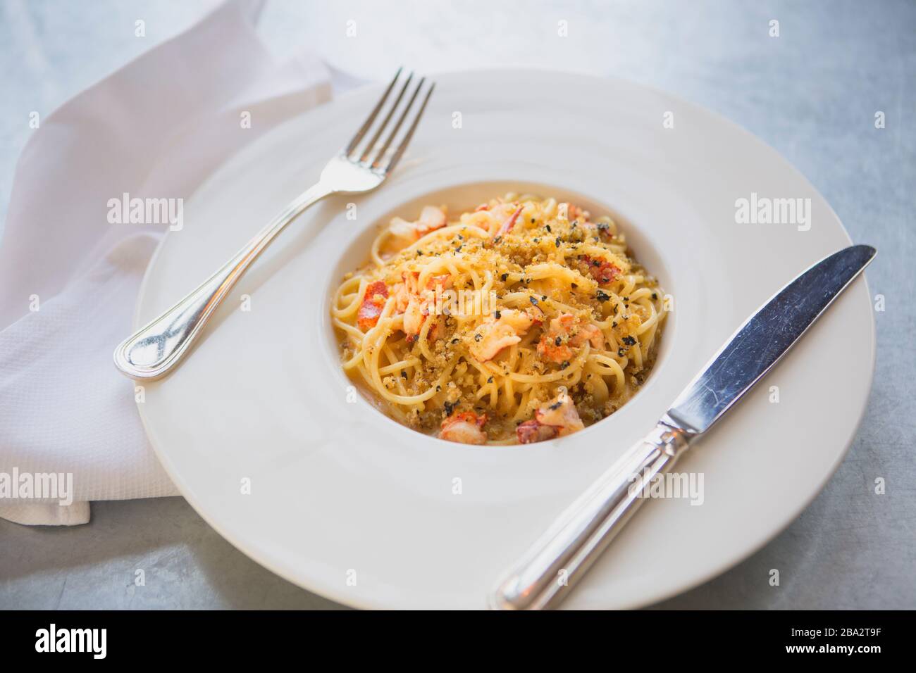 spaghetti with lobster, lobster bisque and nori breadcrumbs Stock Photo
