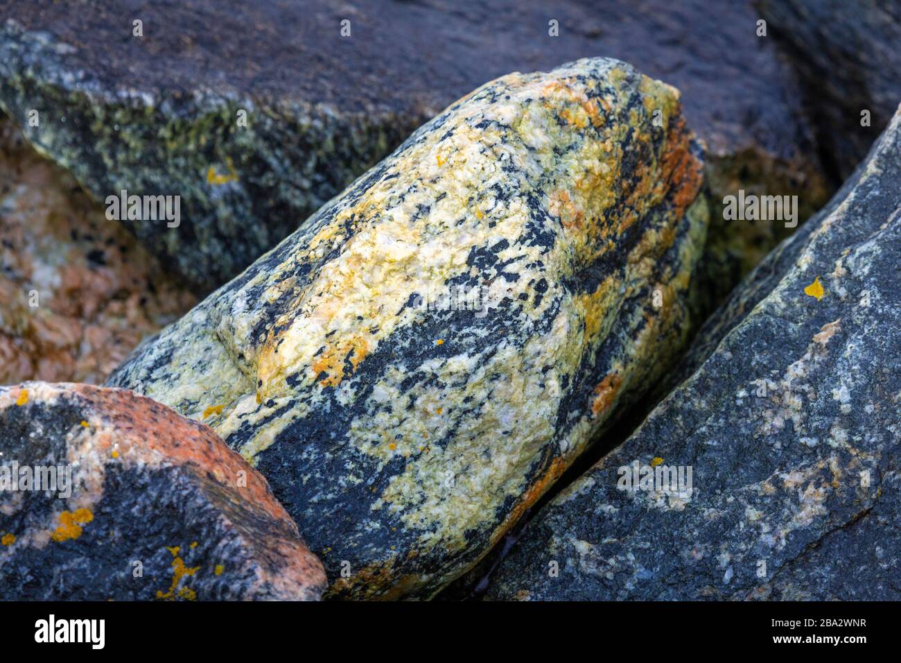 Close shots of parts of stones at the harbour of Alesund at the Norwegian Sea Stock Photo