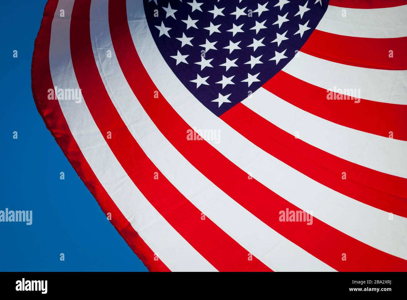 Backlit flying american flag hi-res stock photography and images - Alamy