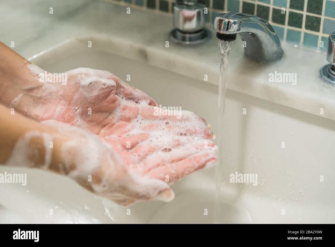 Washing hands with disinfectant soap for prevention of coronavirus. Stock Photo