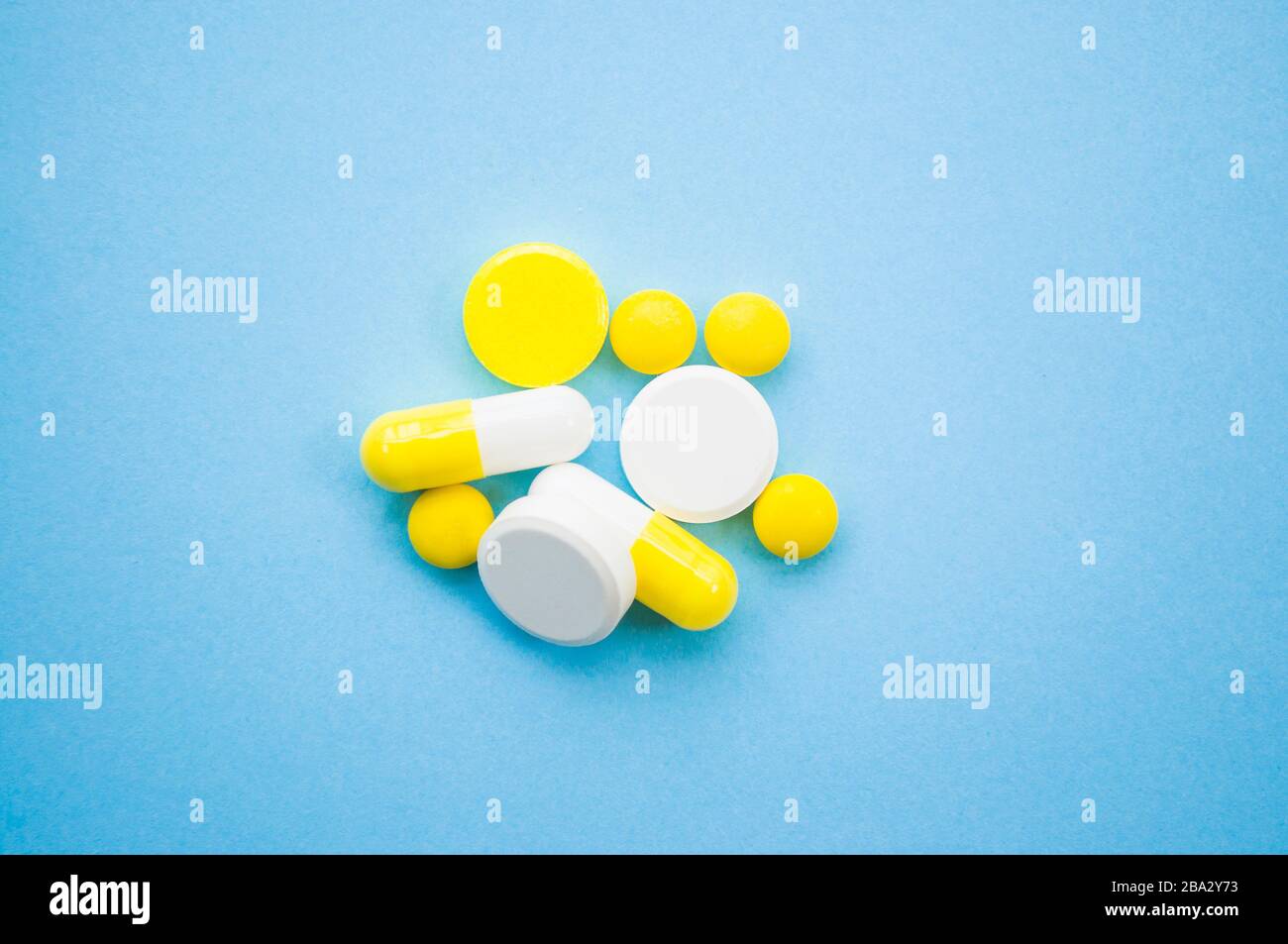 Download Yellow Pills Capsules And Tablets On Blue Mask Background Stop Coronavirus Concept Protect Yourself Stock Photo Alamy PSD Mockup Templates