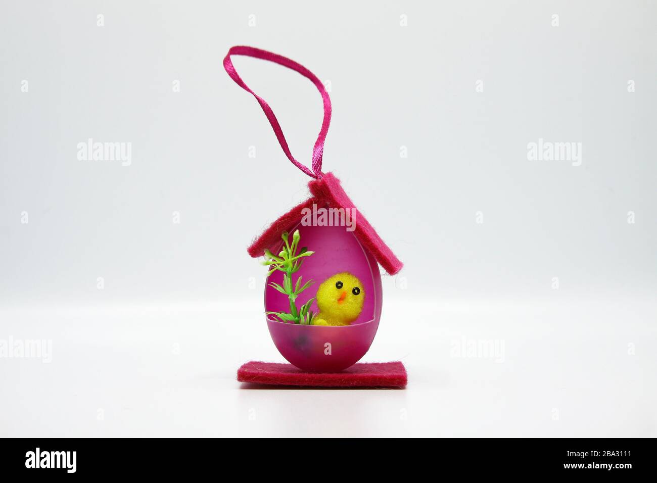 Easter chicks in houses made of colorful eggs Stock Photo