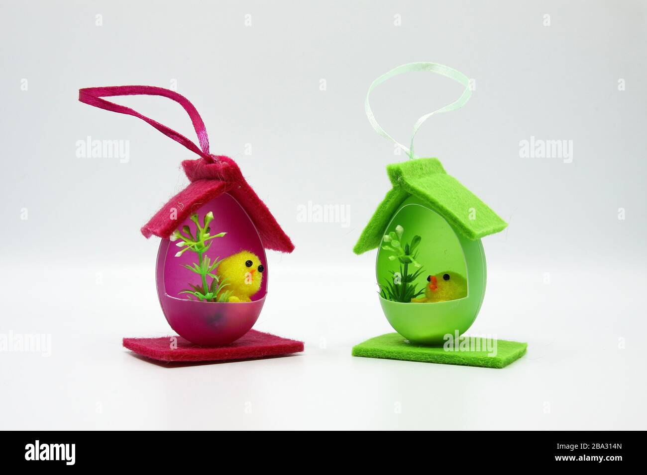 Easter chicks in houses made of colorful eggs Stock Photo