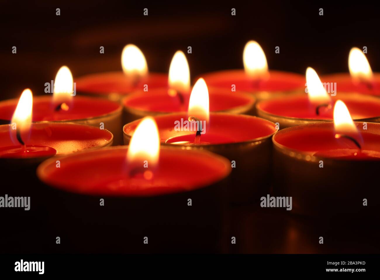 Candles burning in the dark Stock Photo Alamy