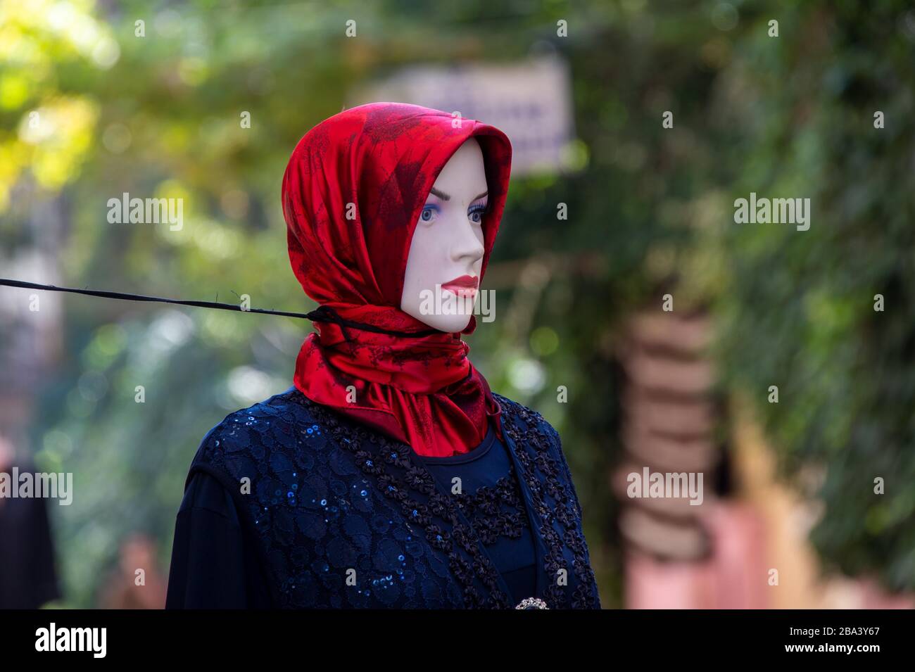Strikingly decorated mannequin is secured against falling over with a rope, Istanbul, Turkey Stock Photo