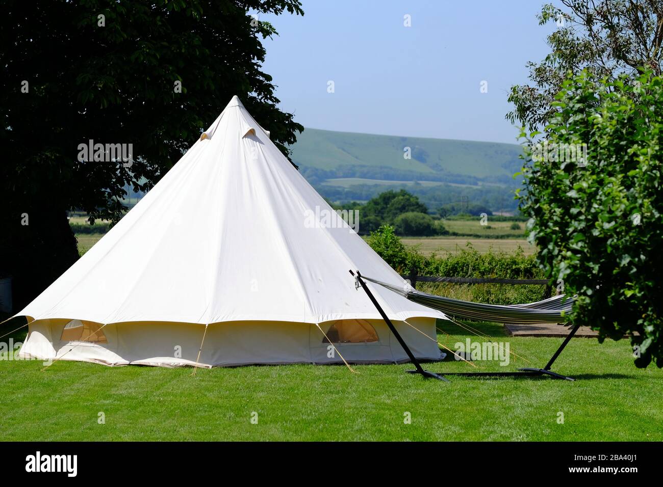 Bell tent in a garden on a summer day. Stock Photo