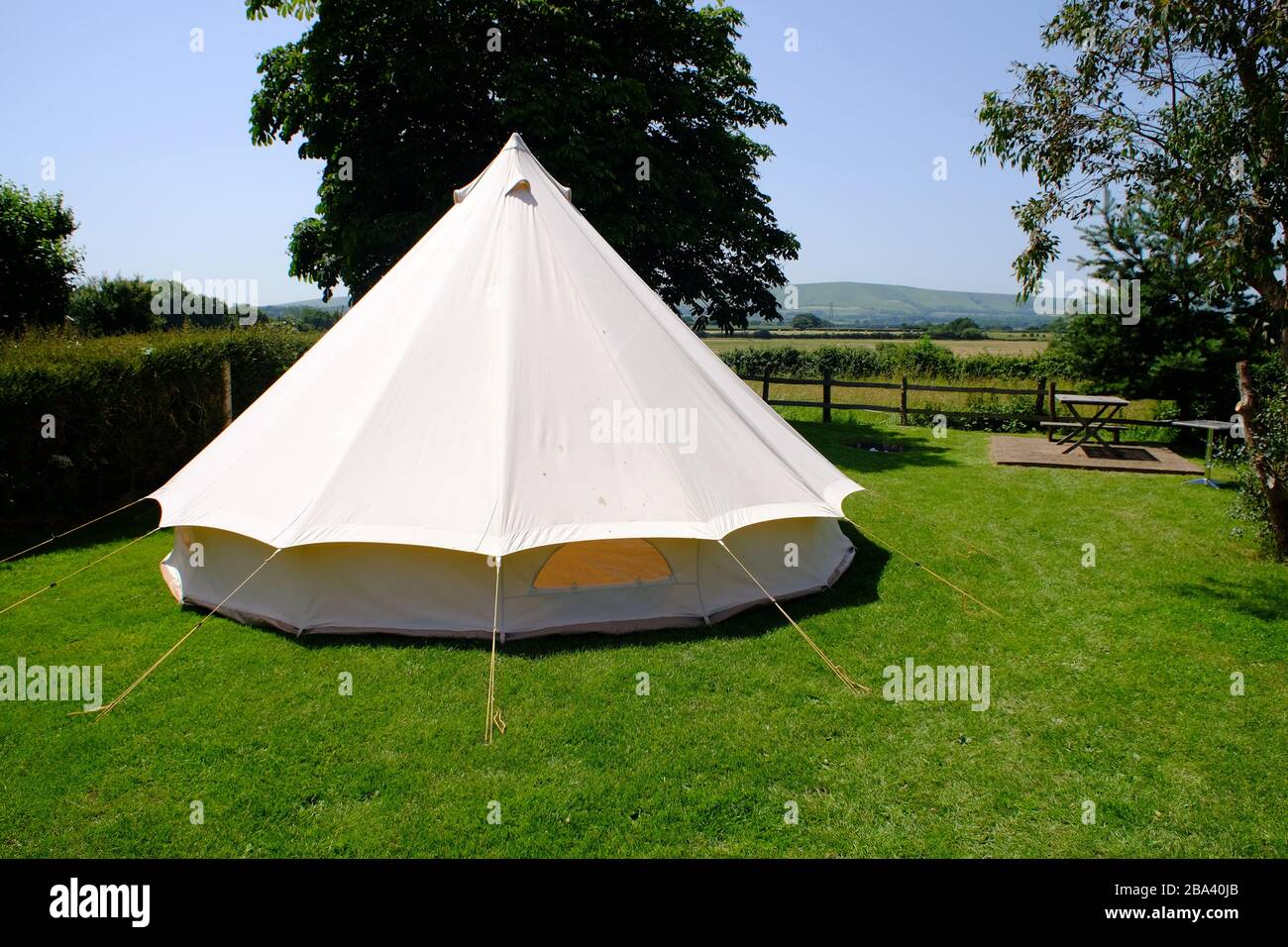 Bell tent in a garden on a summer day. Stock Photo