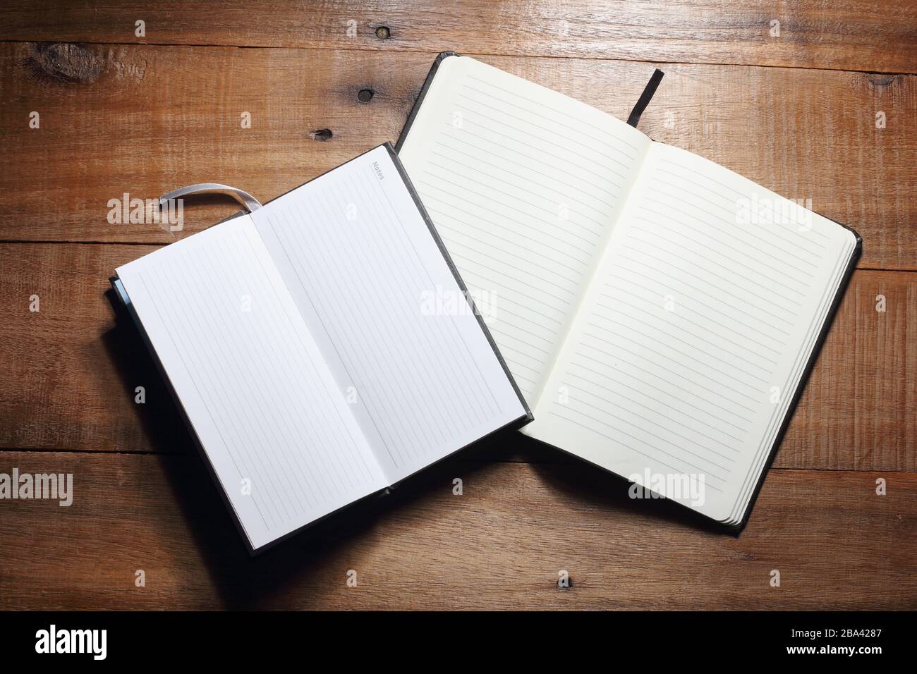 Notebooks on Wooden Background Stock Photo