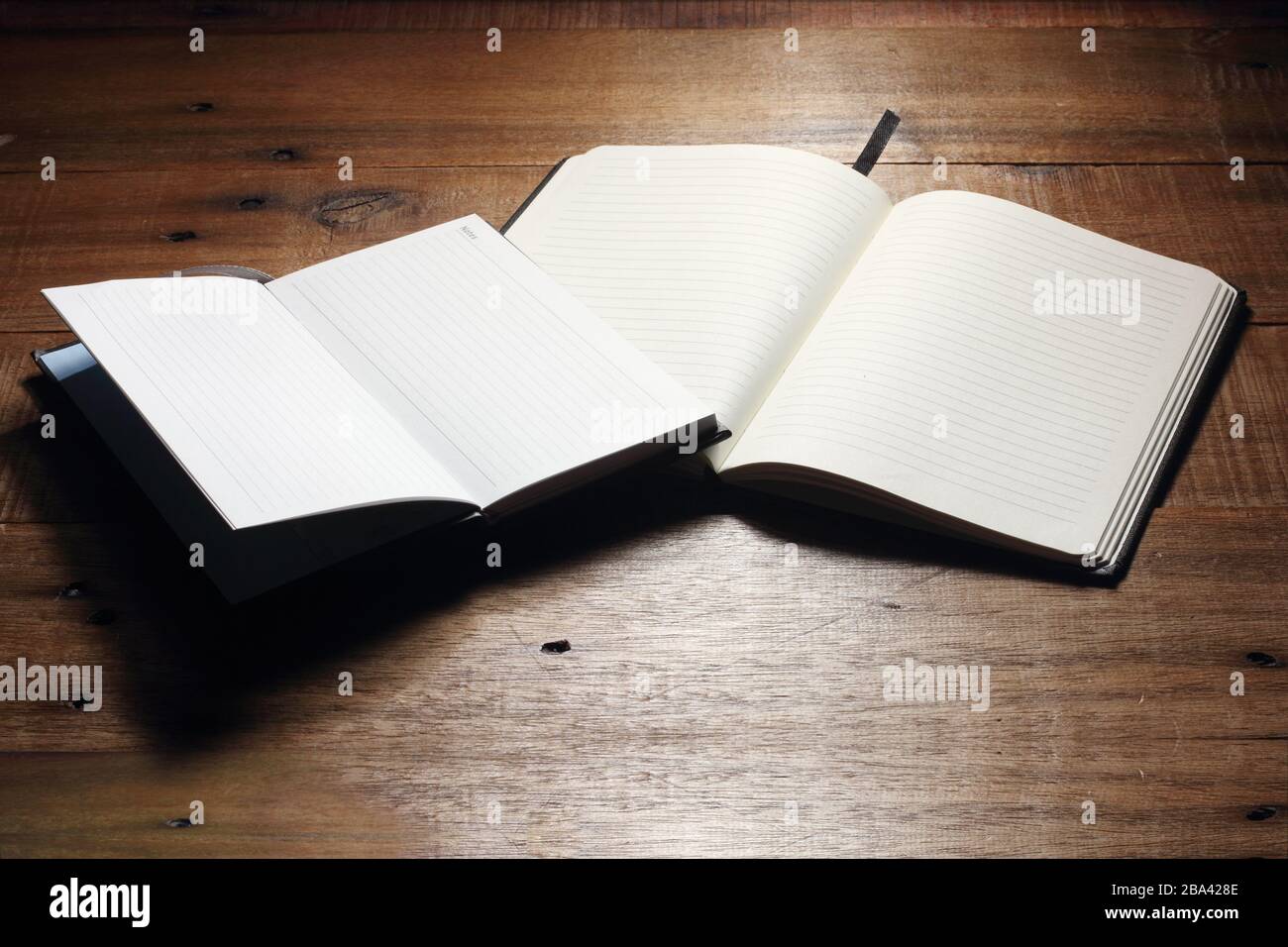 Notebooks on Wooden Background Stock Photo