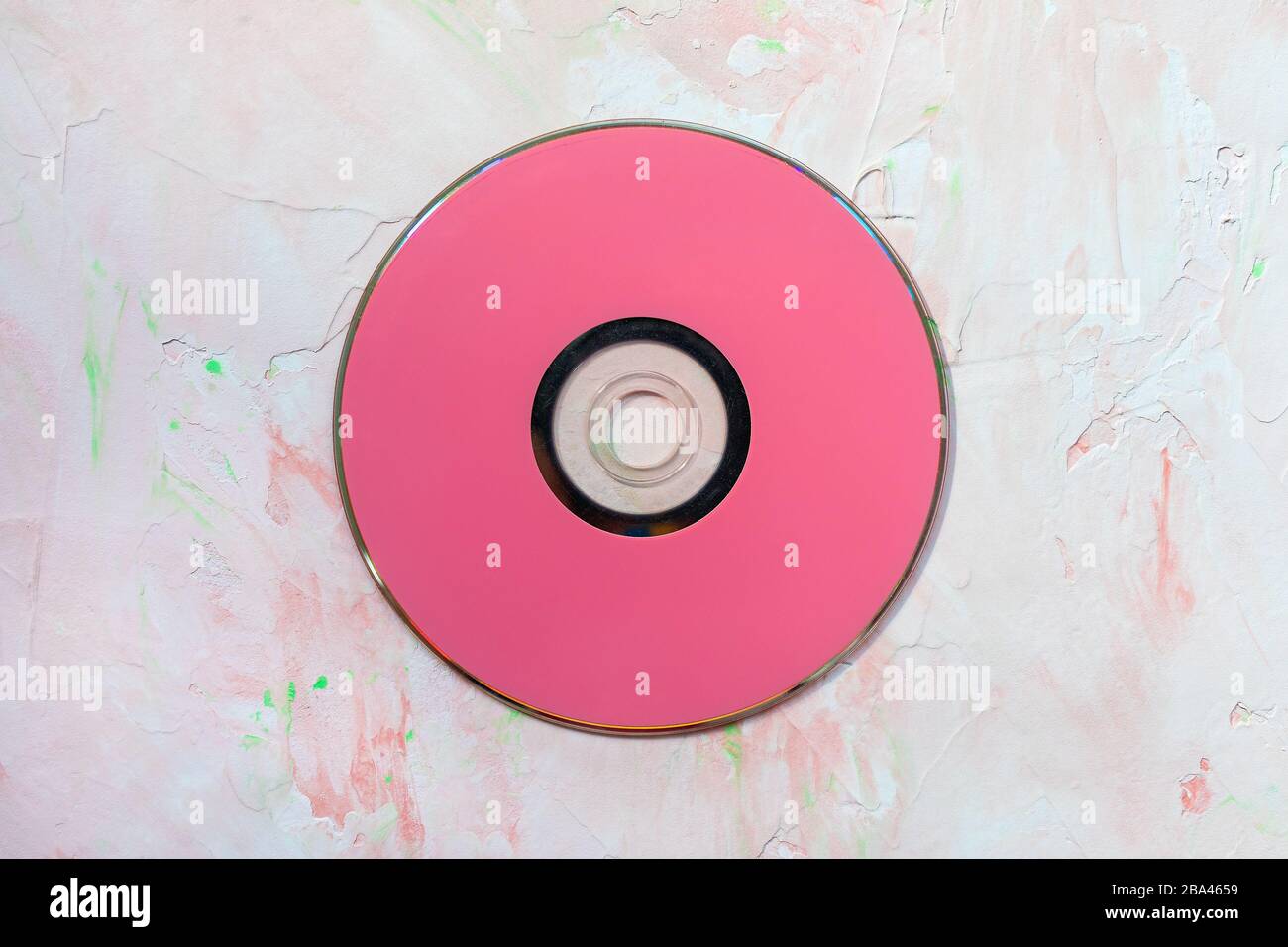 Red CD or DVD disc on pink. Retro minimalist background, copy space Stock  Photo - Alamy