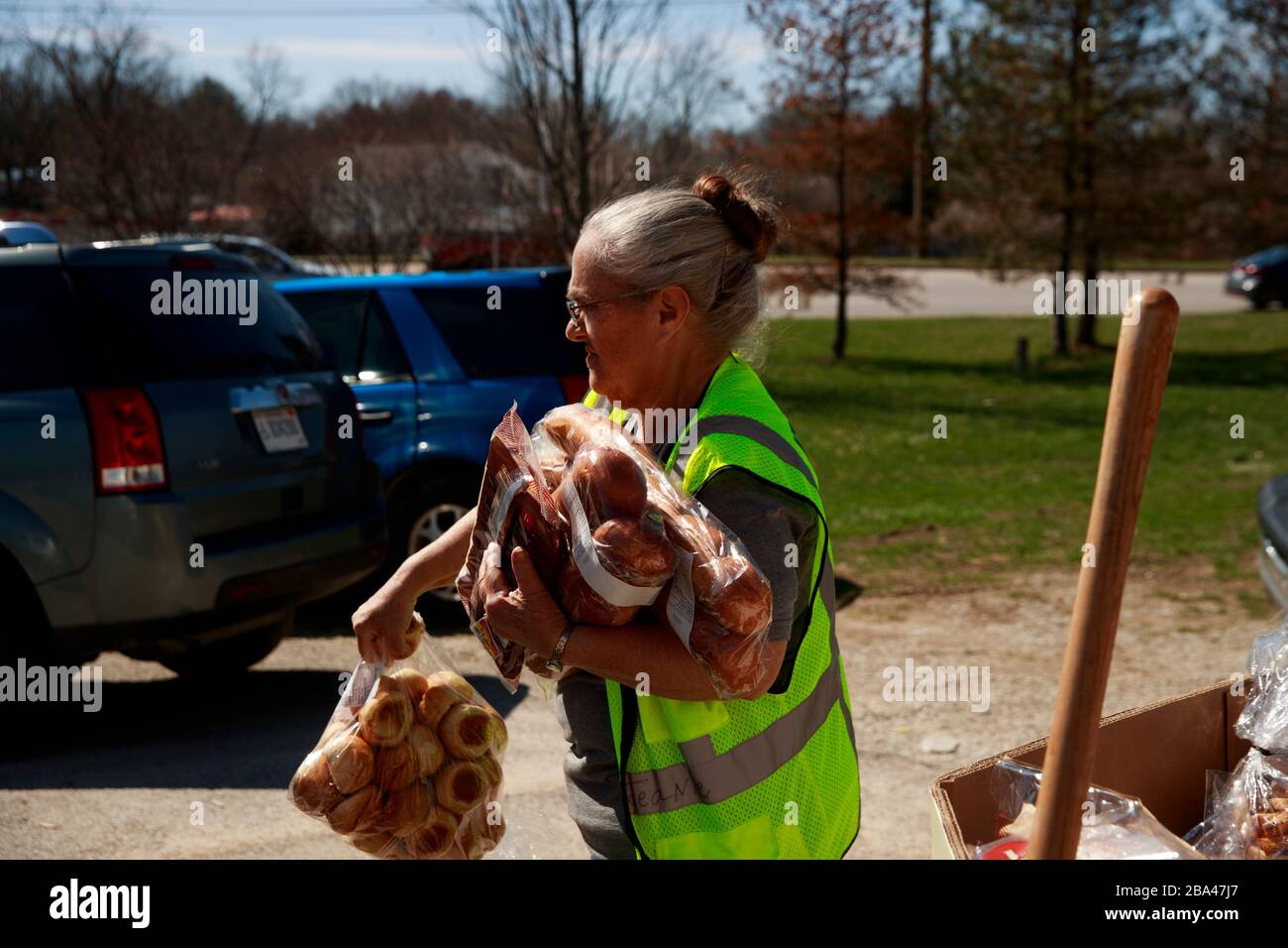 A volunteer at Pantry 279, located at Trinity Lutheran Church, carries