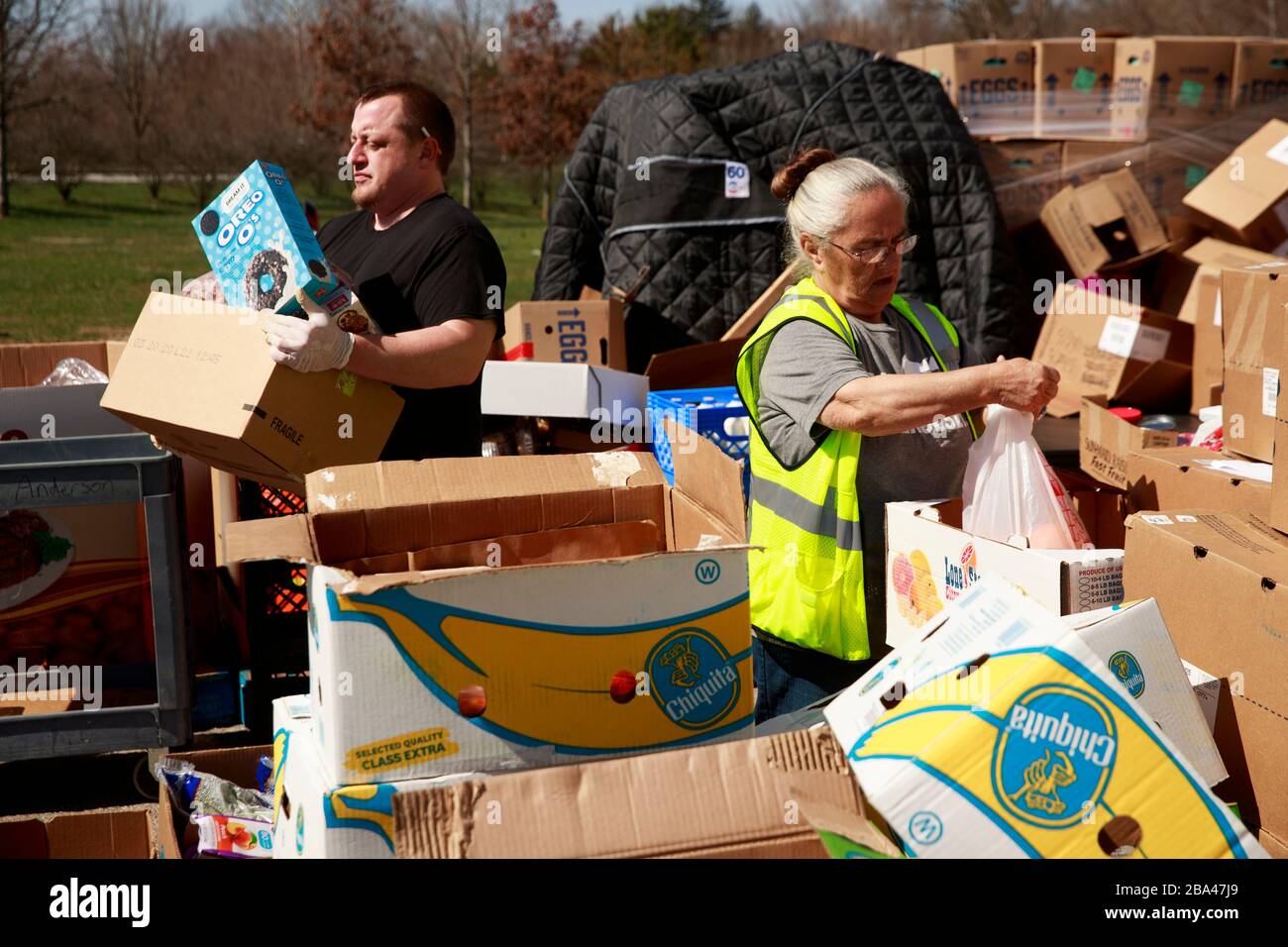 A volunteer at Pantry 279, located at Trinity Lutheran Church, carries