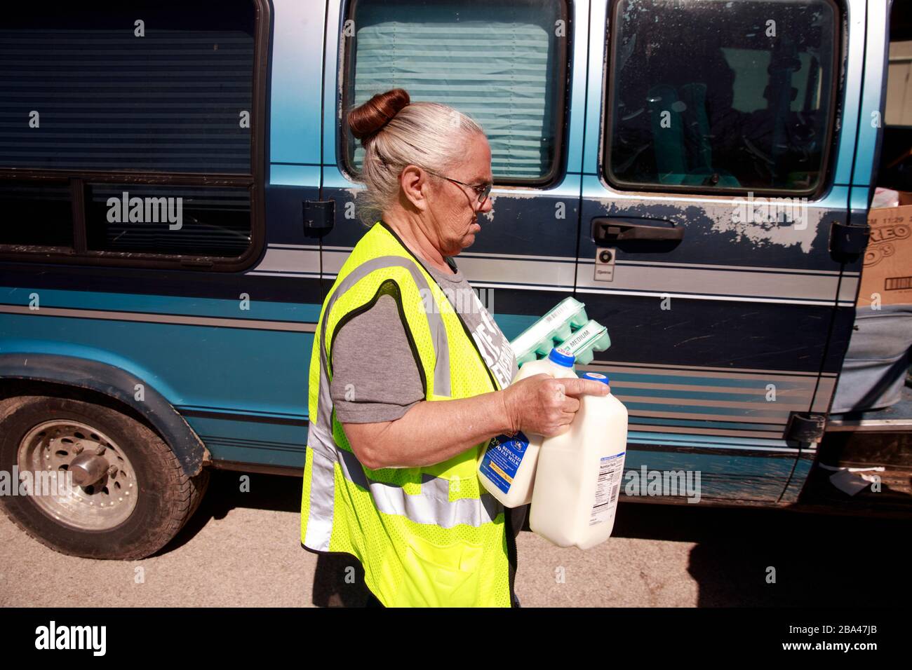 A volunteer at Pantry 279, located at Trinity Lutheran Church, carries