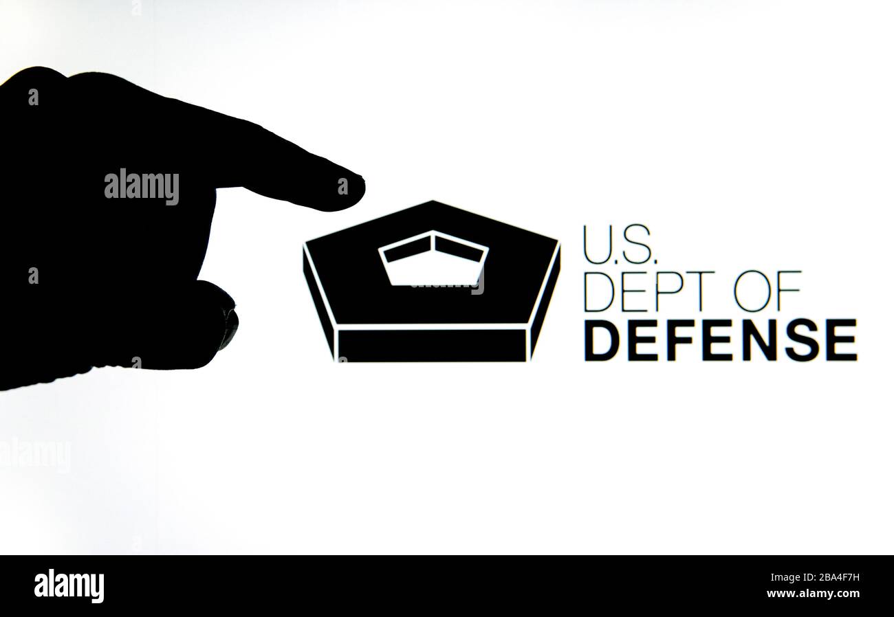 Stone / United Kingdom - March 25 2019: Silhouette of hand and US Dept of Defence on the blurred background Stock Photo