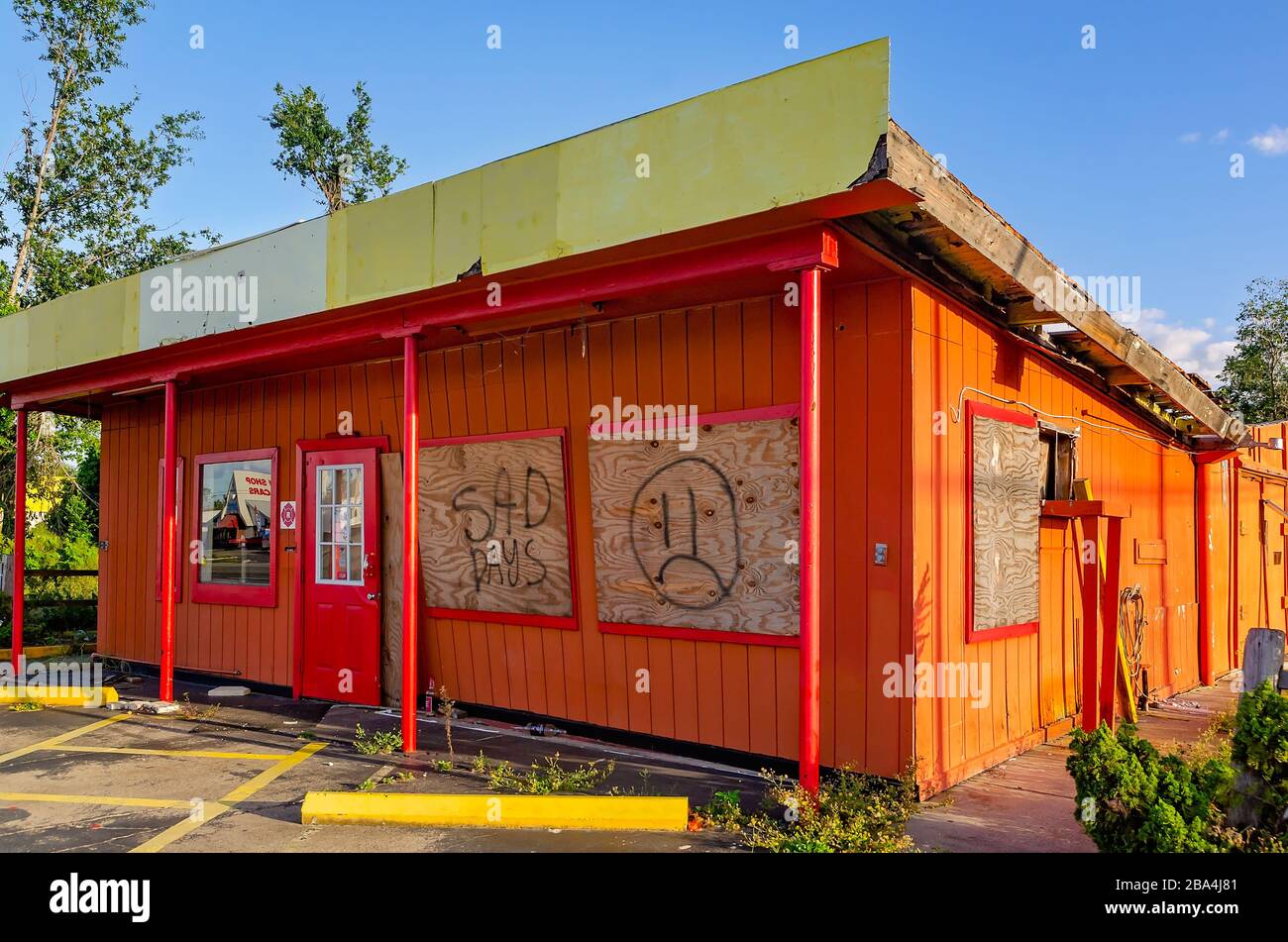 A business remains boarded up and closed a year after Hurricane Michael, Sept. 21, 2019, in Panama City, Florida. Stock Photo