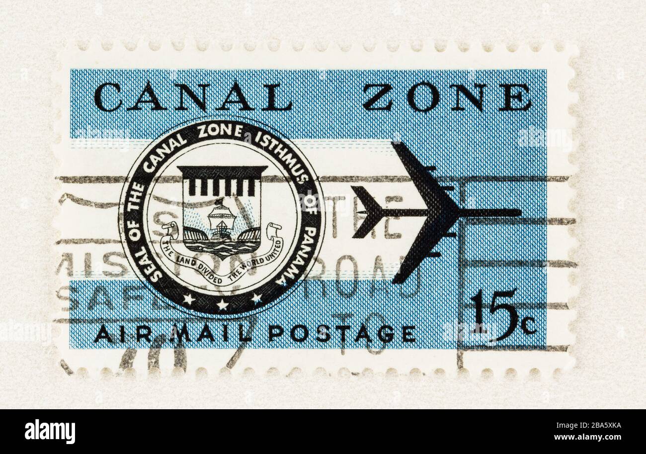 SEATTLE WASHINGTON - March 25, 2020: Close up of used blue 15 cent postage stamp of Panama Canal Zone with seal and jet, for airmail. Scott #C44.. Stock Photo