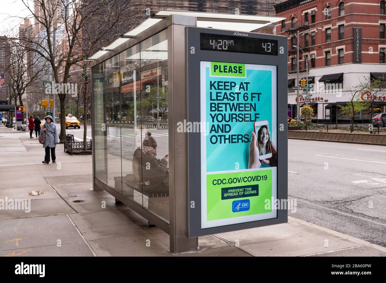 NEW YORK, NY - MARCH 25, 2020. Public Service message regarding the Coronavirus outbreak is displayed on a bus shelter on the Upper West Side of Manhattan in New York City. The World Health Organization declared coronavirus (COVID-19) a global pandemic on March 11th. Stock Photo