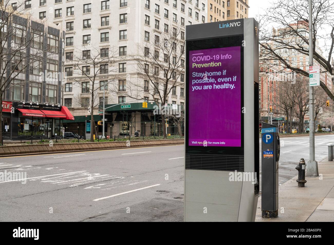 NEW YORK, NY - MARCH 25, 2020. Public Service messages regarding the Coronavirus outbreak are displayed on a LinkNYC kiosk on the Upper West Side of Manhattan in New York City. The World Health Organization declared coronavirus (COVID-19) a global pandemic on March 11th. Stock Photo